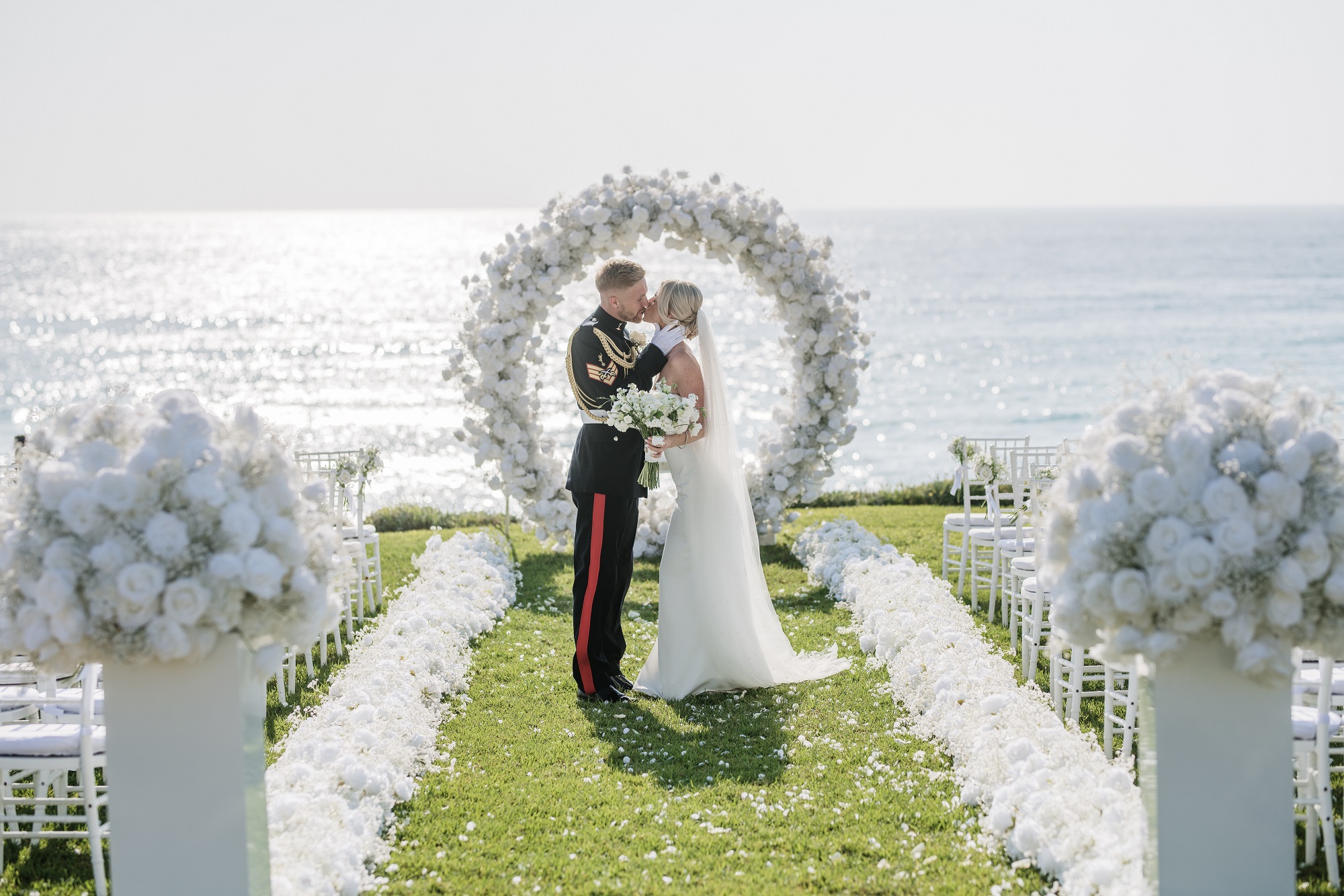 White moongate round arch with roses and gypsophila ceremony styling Cyprus